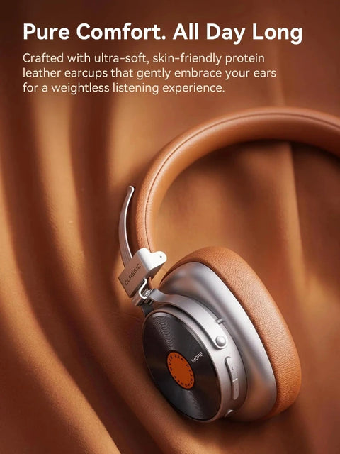Brown over-ear headphones with silver and black accents, styled on a draped brown fabric background with promotional text at the top.