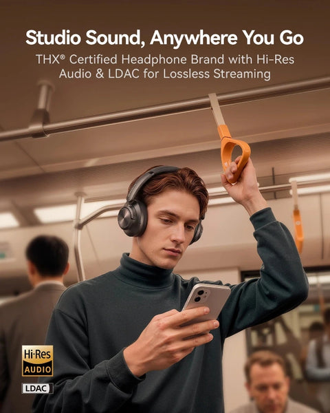 A man in a subway station wearing over-ear headphones and holding a phone, with orange hand straps overhead. Large text at the top reads 'Studio Sound, Anywhere You Go' and 'THX Certified Headphone Brand with Hi-Res Audio & LDAC for Lossless Streaming,' with 'Hi-Res Audio' and 'LDAC' badges in the lower left.